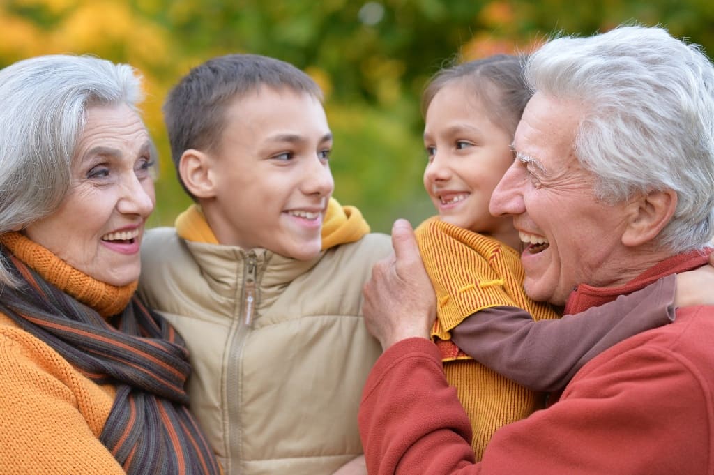 Grandparents Laughing with Their Grandchildren